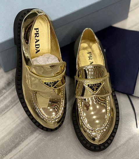 Кожаные золотые женские ботинки Prada
