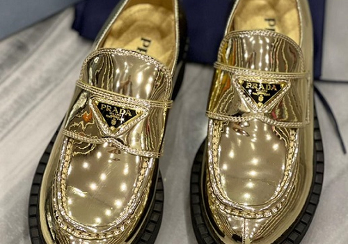 Кожаные золотые женские ботинки Prada