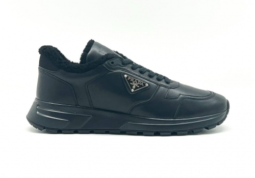 Кожаные кроссовки с мехом Prada черные