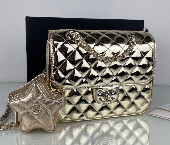 Кожаная золотая сумка Chanel Star Coin Purse