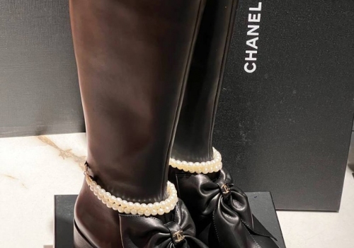 Женские кожаные черные cапоги Chanel с бантом