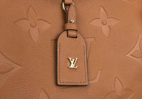 Женская кожаная сумка Louis Vuitton Carry All PM коричневая